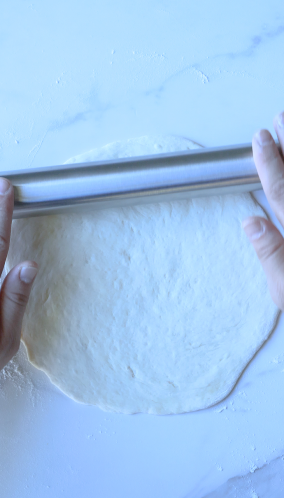 Roll dough into circles, add filling, and fold over sealing the dough.